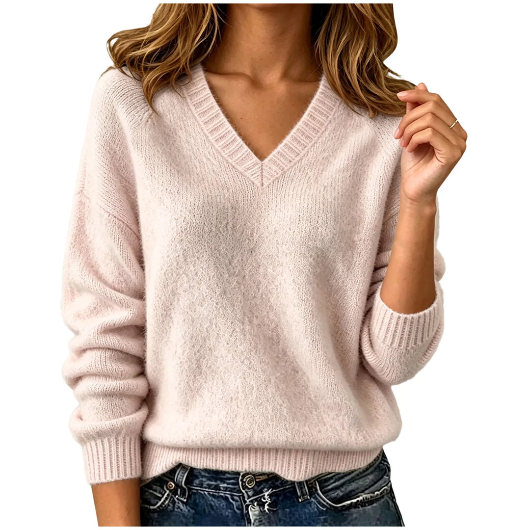 Woman wearing beige oversized V-neck knit sweater