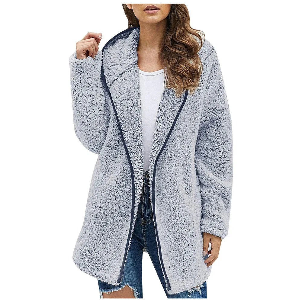 Woman wearing gray blue brushed sherpa hooded jacket with dark trim
