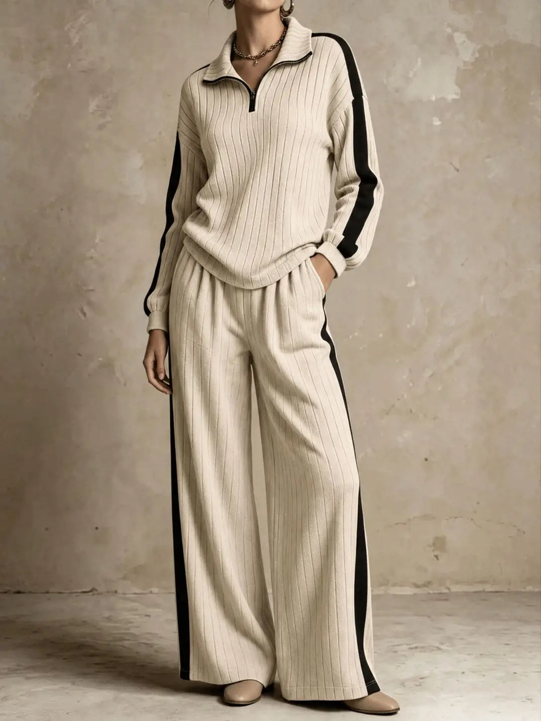 Woman wearing khaki ribbed knit two piece set with black side stripe
