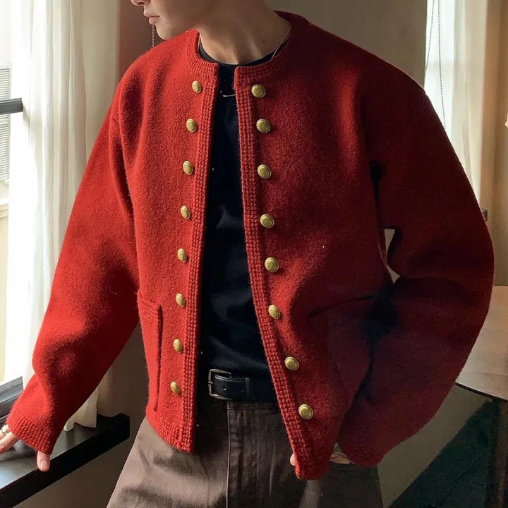 Man wearing red collarless double breasted knit cardigan, close view
