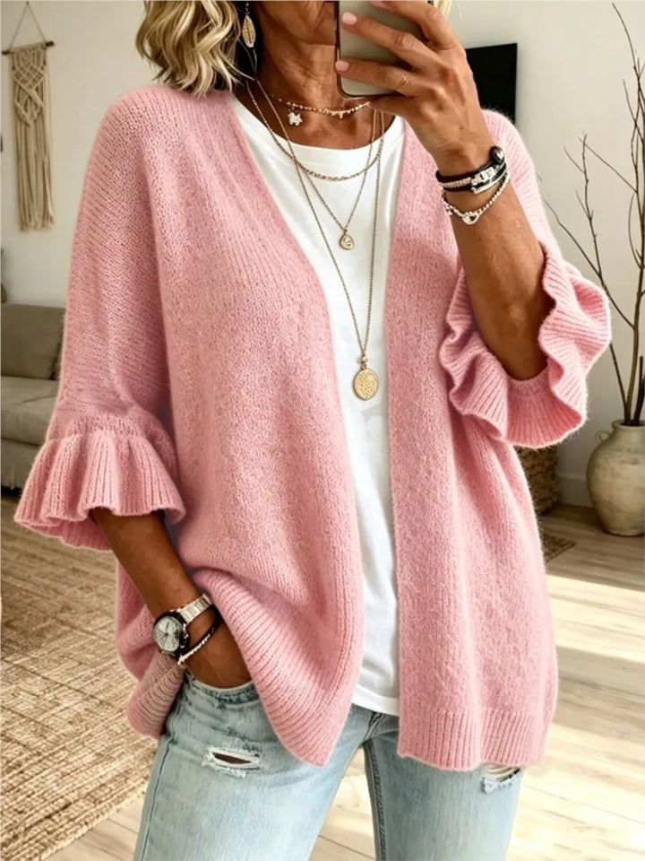Pink knit cardigan with ruffle flare sleeves, front view