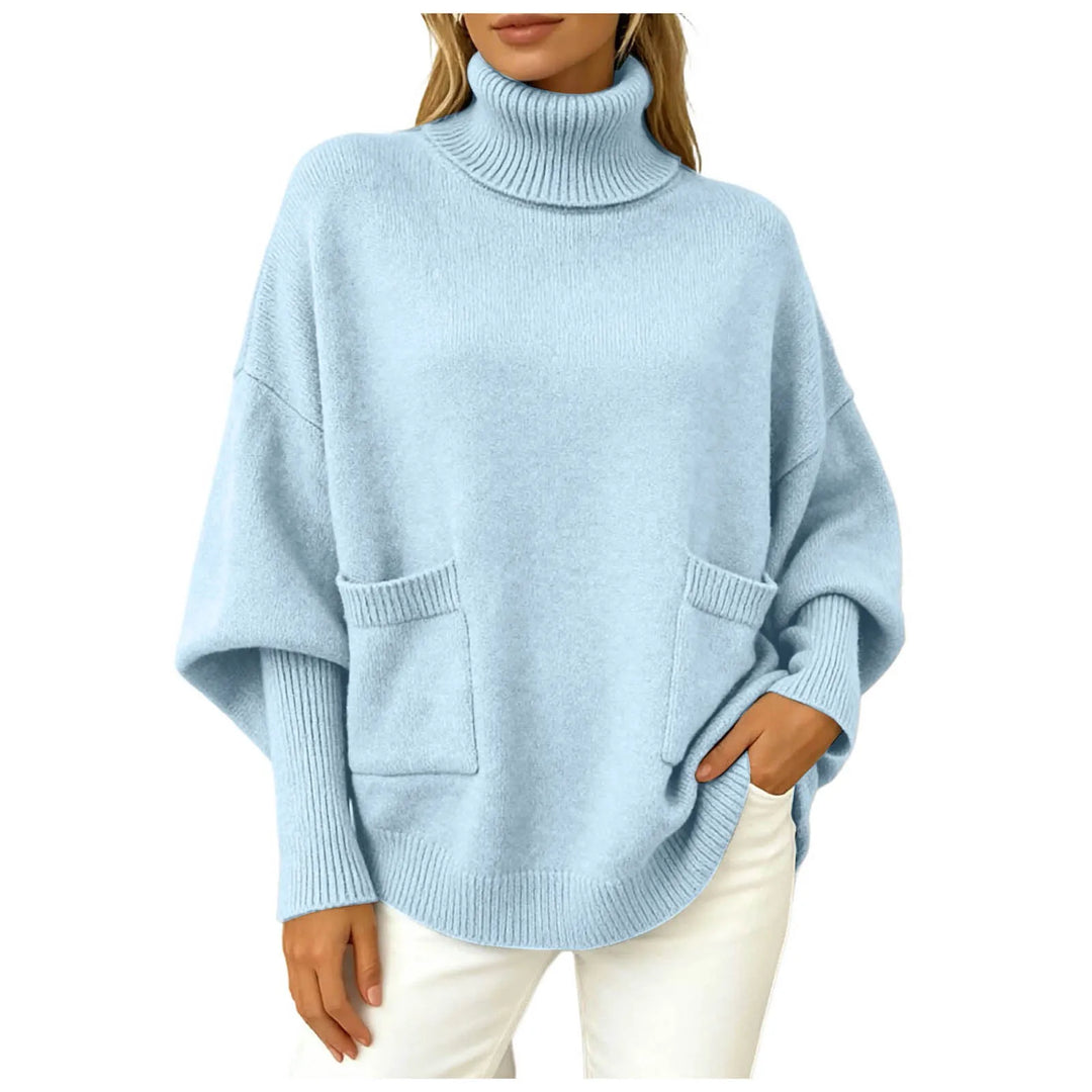Woman wearing sky blue oversized turtleneck sweater with front pockets