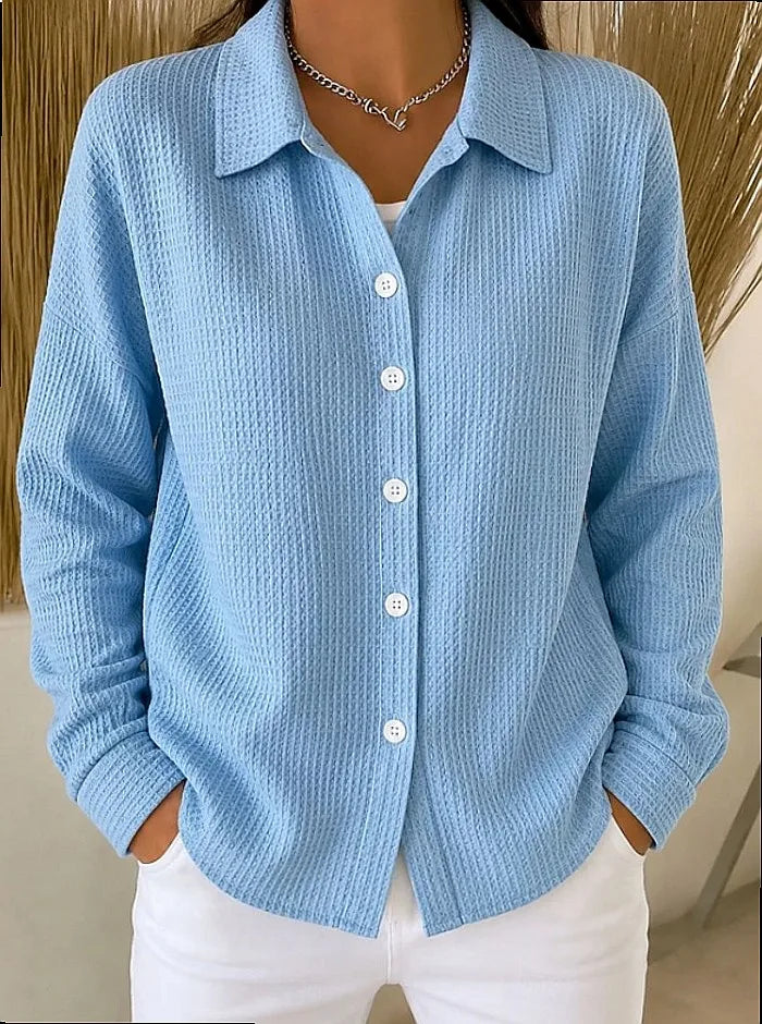 Woman wearing blue waffle knit button-front shirt