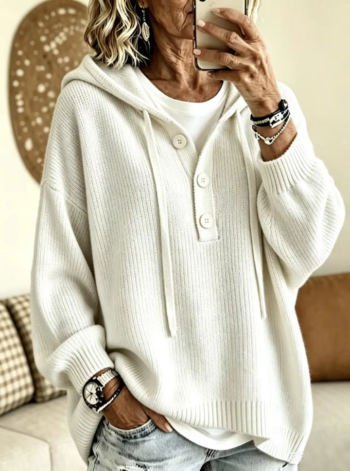 Woman wearing creamy-white ribbed knit hoodie with drawstring