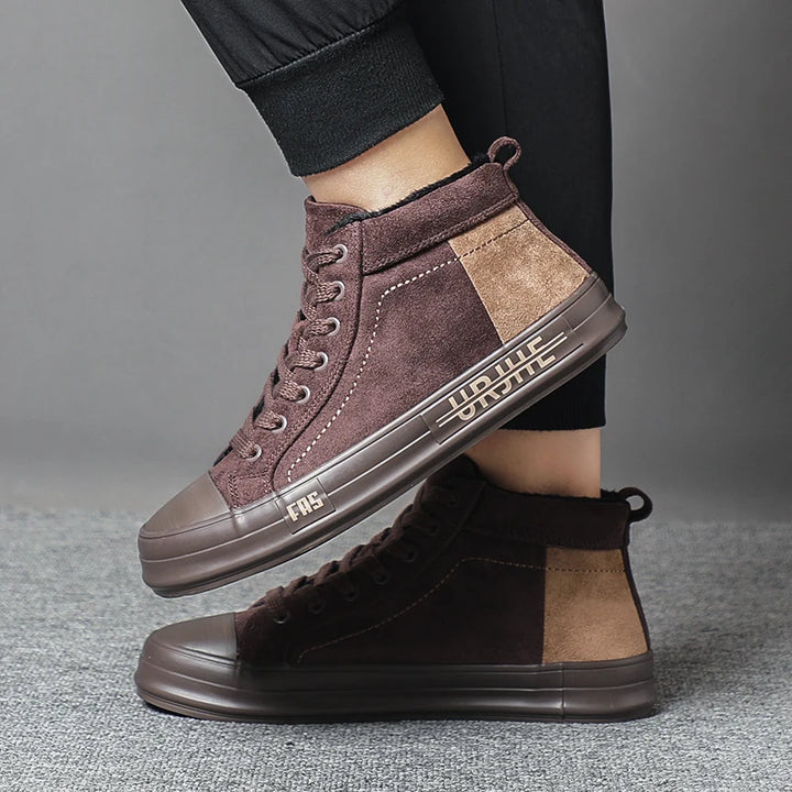Model wearing dark brown high-top sneakers side view