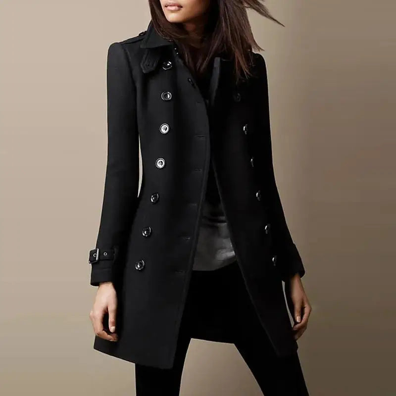 Woman wearing a black double-breasted mid-length coat, front view