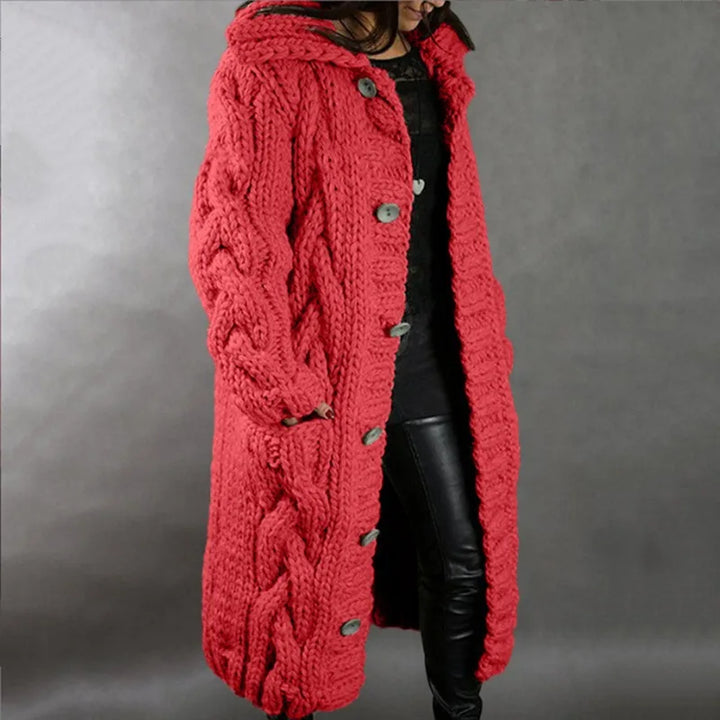 Woman wearing red hooded cable knit long cardigan, front view