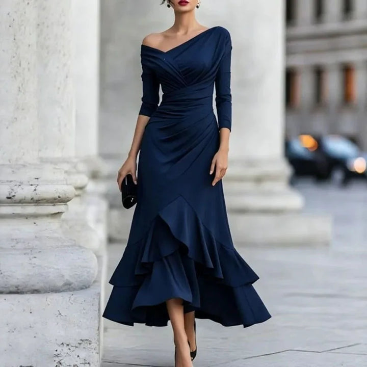 Woman wearing navy blue off-shoulder ruffle hem mermaid dress