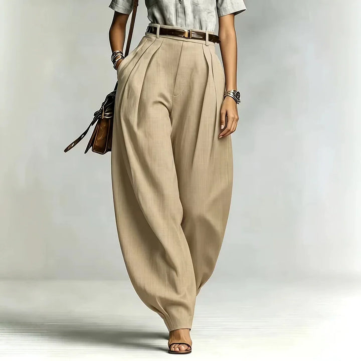 Woman wearing khaki high-waisted balloon wide leg pants, front view