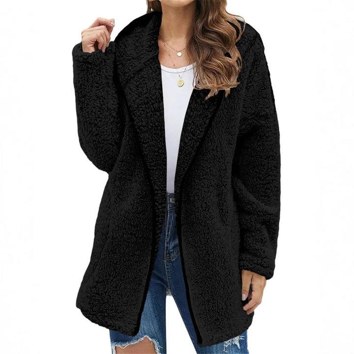 Woman wearing black brushed sherpa hooded jacket
