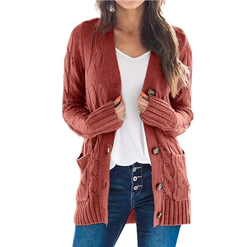 Woman wearing rust red cable knit cardigan