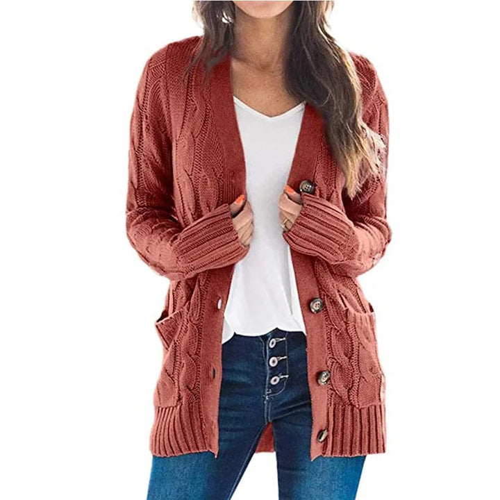 Woman wearing rust red cable knit cardigan