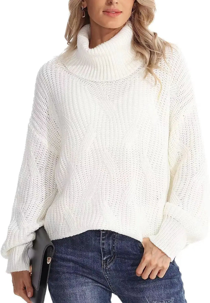 Woman wearing white cable knit turtleneck sweater with clutch