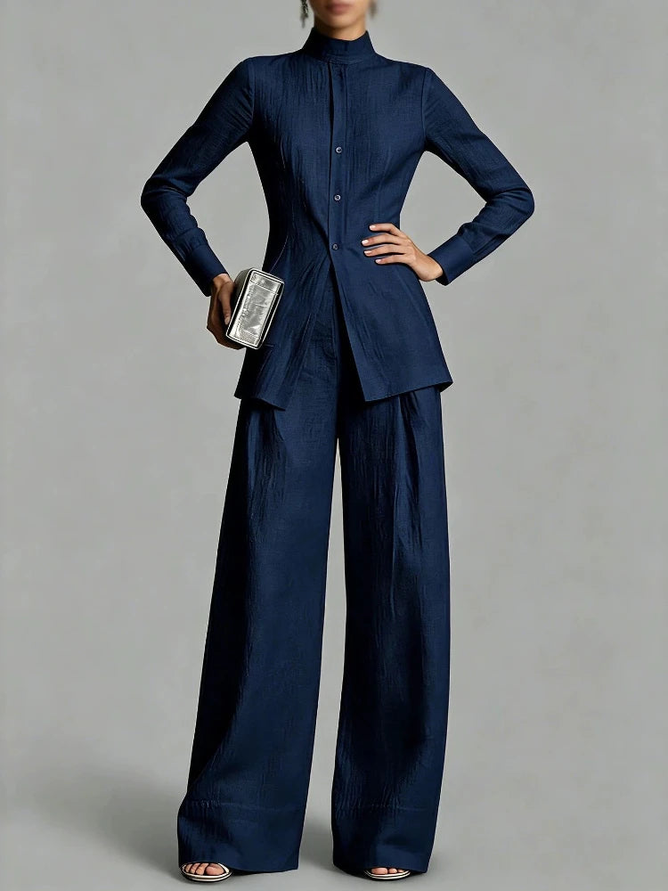 Woman wearing navy blue mock neck top and wide leg pants set, front view