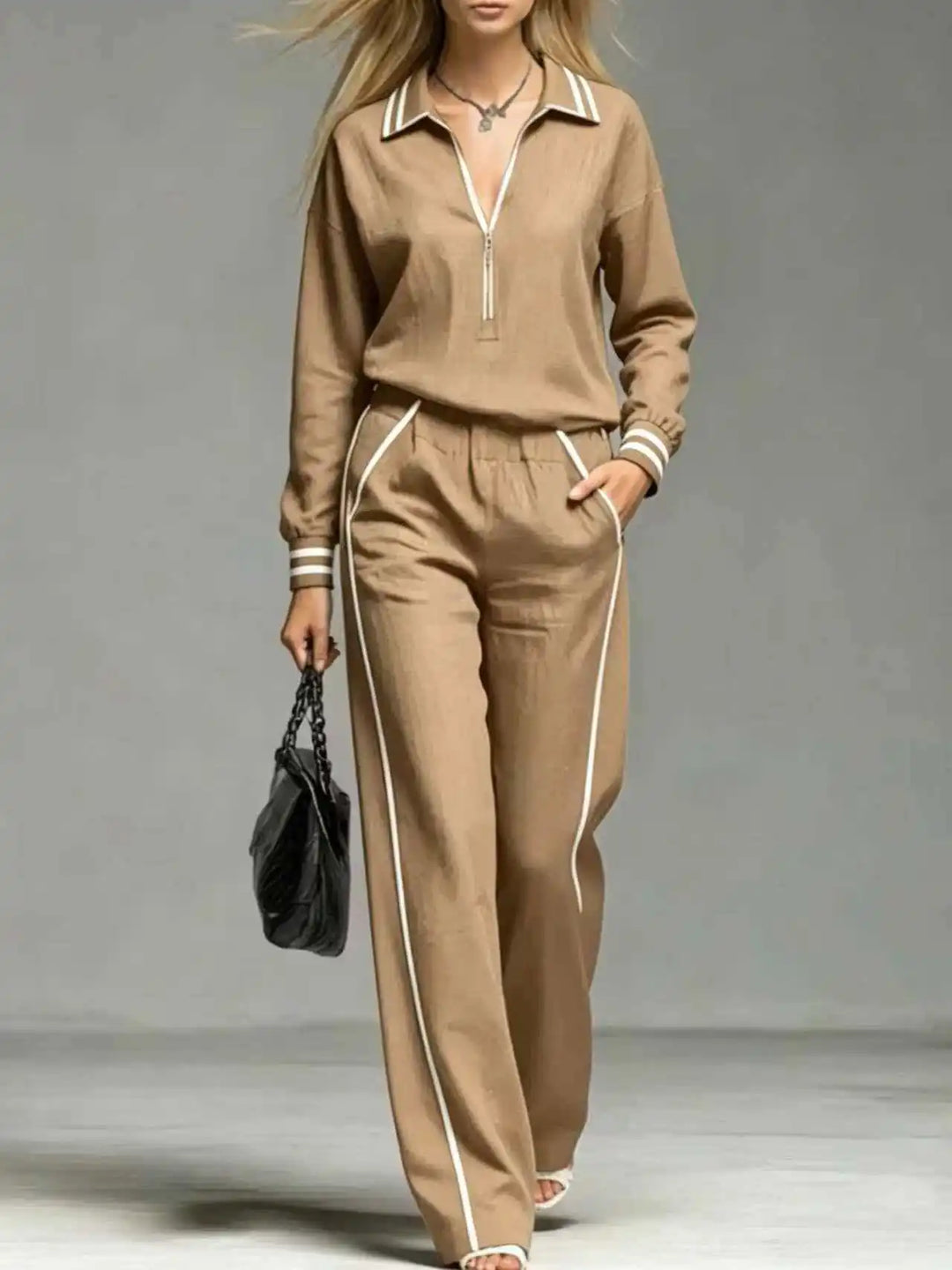 Woman wearing khaki half-zip two piece pant set close up