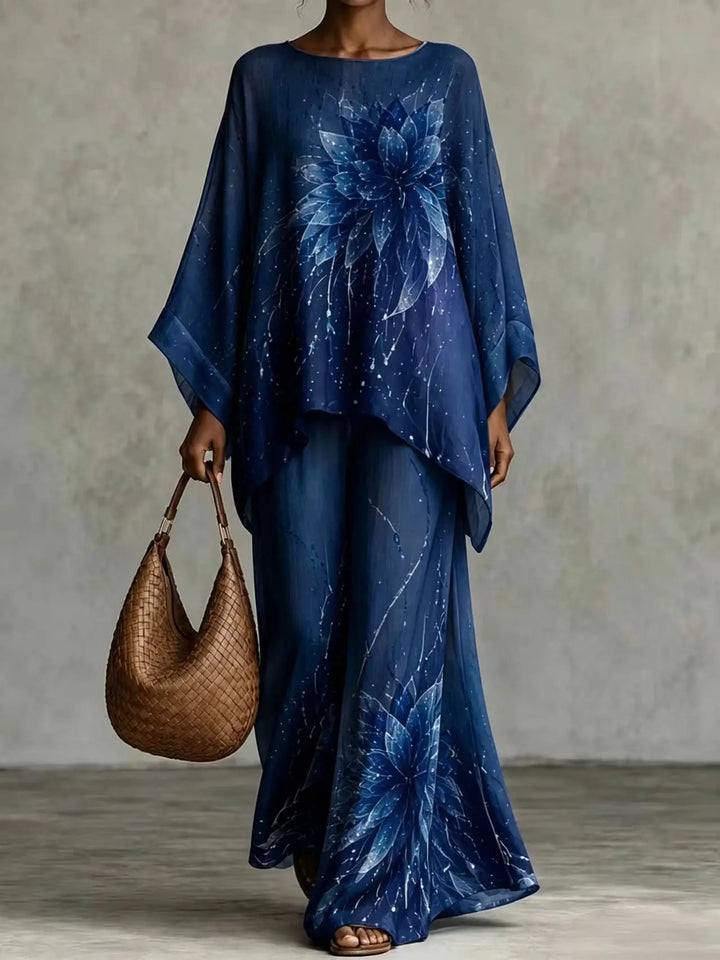 Woman wearing navy blue floral print batwing top and wide leg pants set