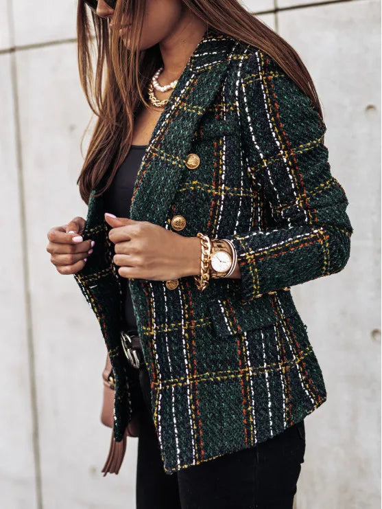 Close up of green plaid blazer sleeve and button detail
