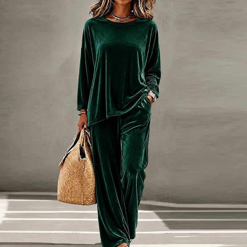 Woman wearing green velvet two piece pants set