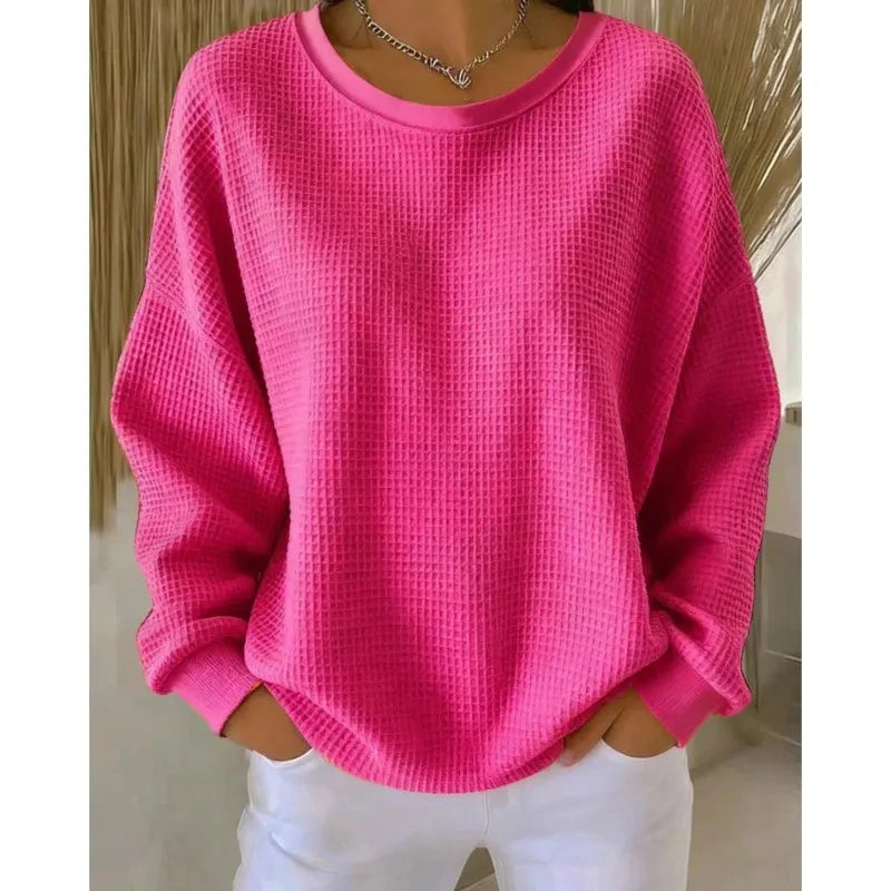 Woman wearing pink waffle knit oversized top