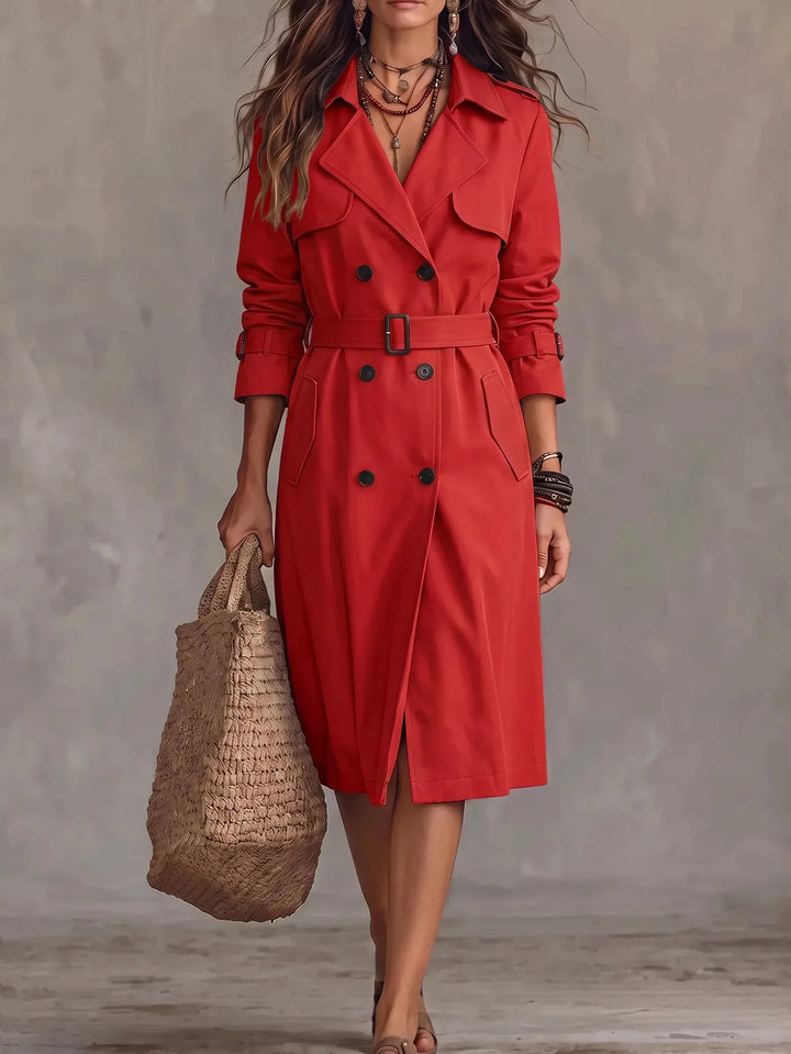 Woman wearing red trench coat with belt, full front view