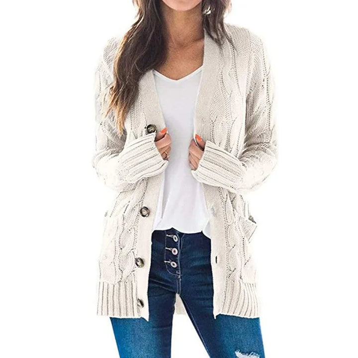 Woman wearing beige cable knit open front cardigan