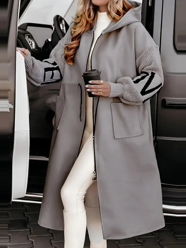 Gray hooded maxi coat with contrast knit sleeves and drawstring waist