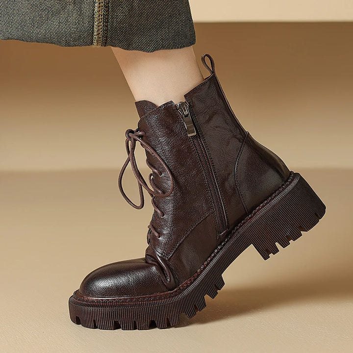 Side view of brown leather lace-up ankle boot on model