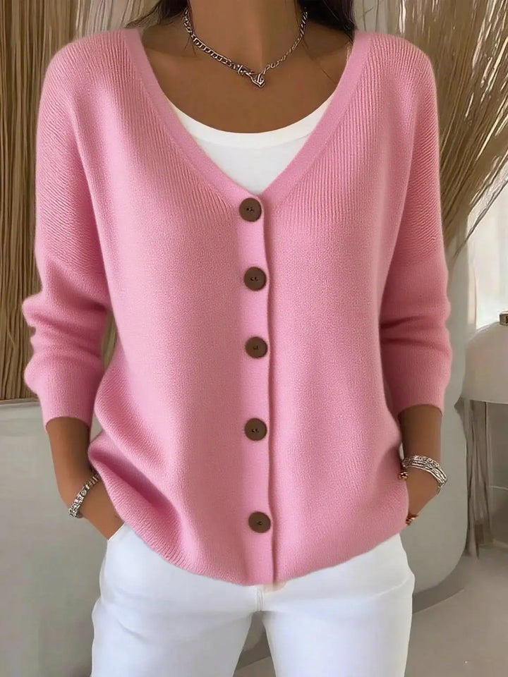 Woman wearing pink button front knit cardigan