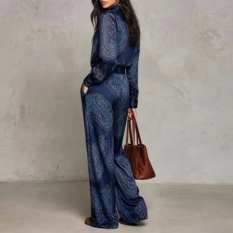 Back view of dark blue paisley print two-piece shirt and wide leg pants set