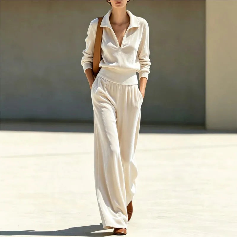 Woman wearing apricot velour half-zip top and wide leg pants set, front view walking