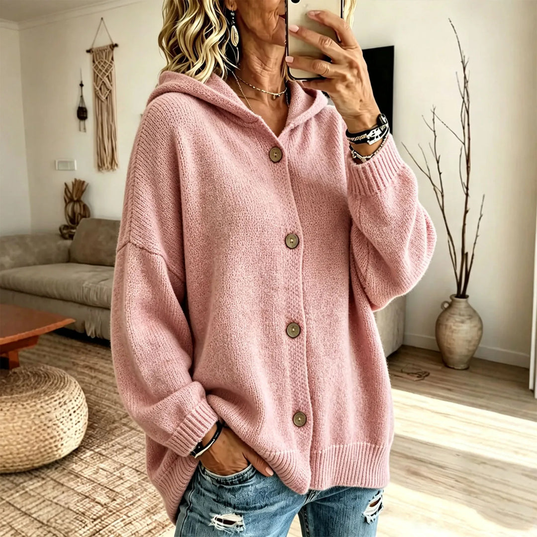 Woman wearing pink hooded button front cardigan with balloon sleeves