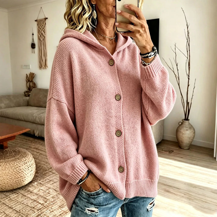 Woman wearing pink hooded button front cardigan with balloon sleeves