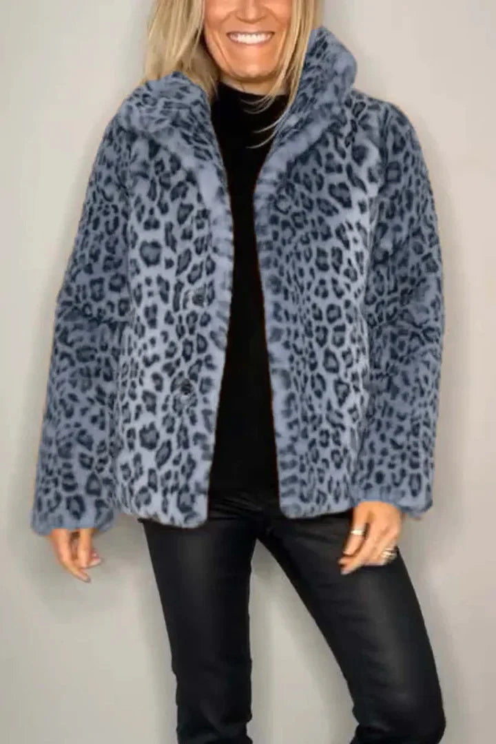 Model wearing blue-gray leopard print faux fur coat