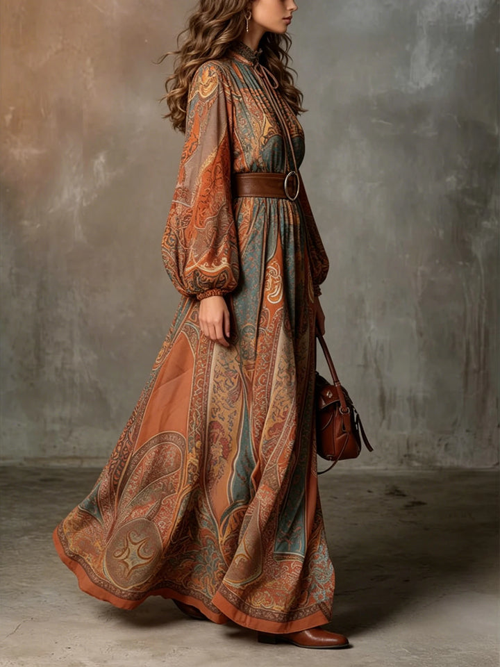 Side profile of paisley print maxi dress showing flowing skirt silhouette