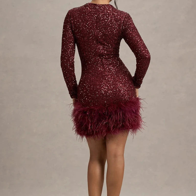 Burgundy sequin mini dress with feather hem, back view