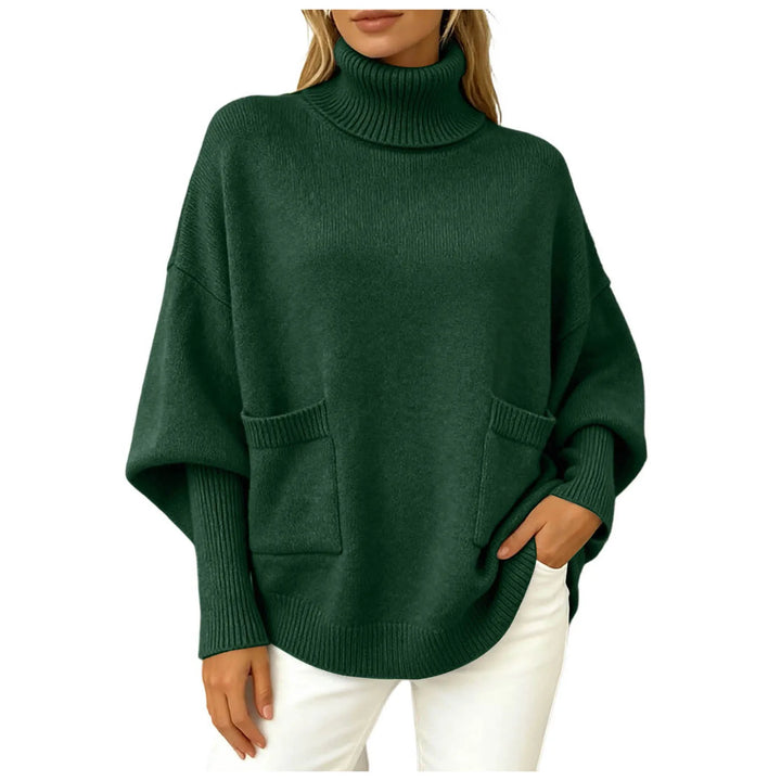 Woman wearing dark green oversized turtleneck sweater with front pockets