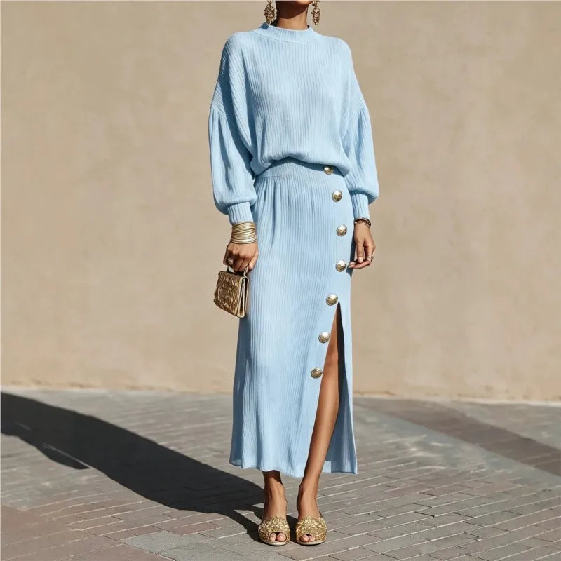 Woman in light blue ribbed sweater dress with button side slit