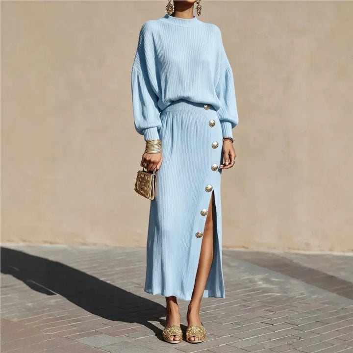 Woman in light blue ribbed sweater dress with button side slit