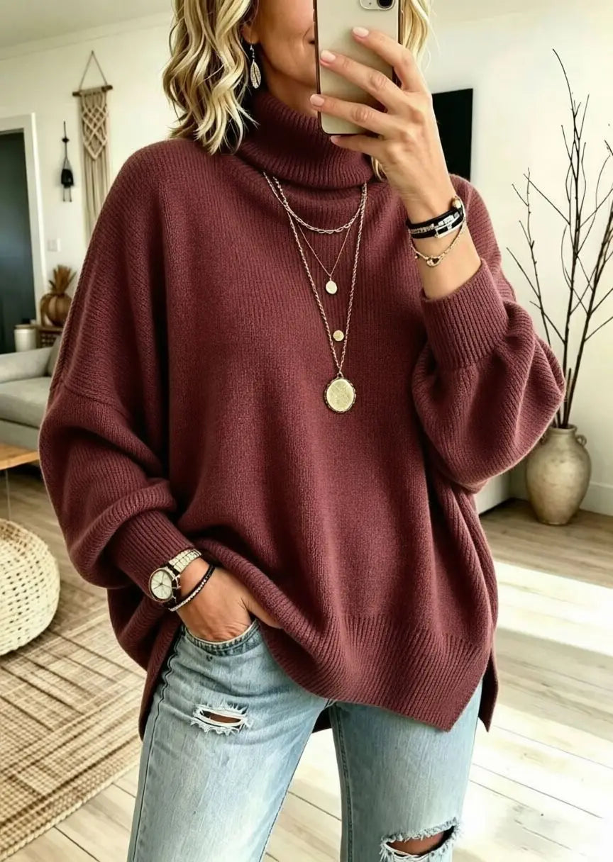 Woman wearing burgundy oversized turtleneck sweater