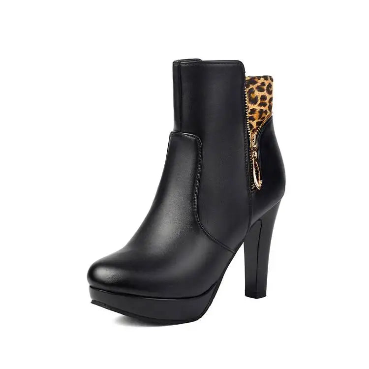 Black ankle boot with leopard print zip detail on white background