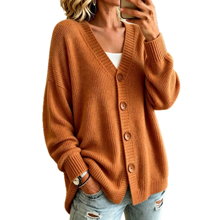 Rust orange oversized button-front cardigan on white background