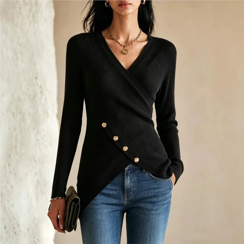 Woman wearing black wrap-front ribbed knit top with gold buttons