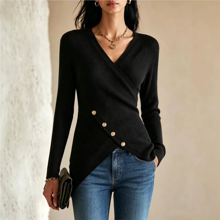 Woman wearing black wrap-front ribbed knit top with gold buttons