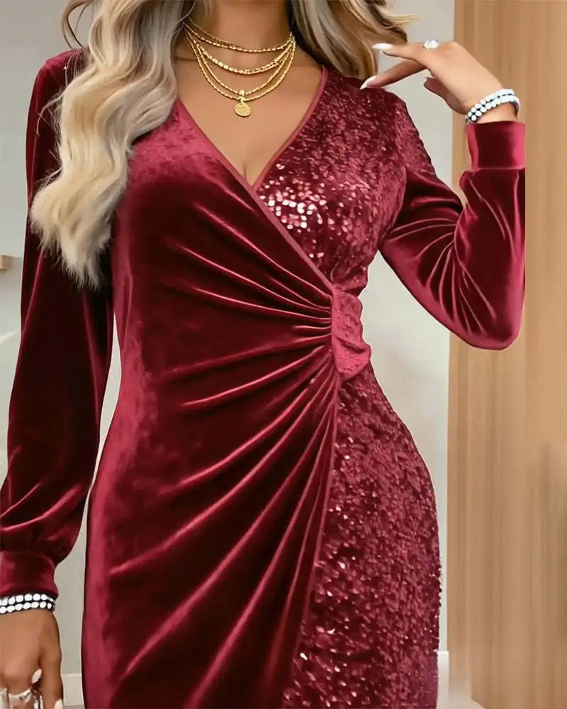 Close up of burgundy velvet sequin dress waist detail