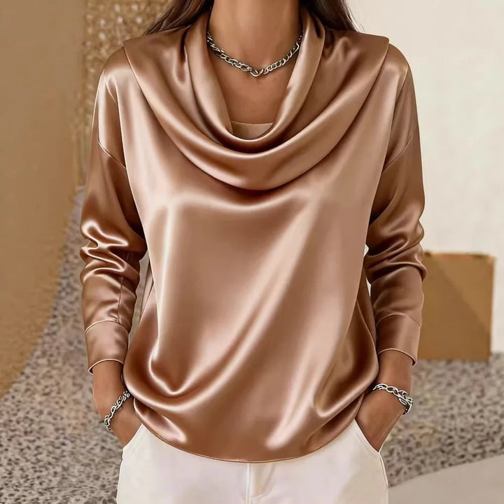 Woman wearing bronze satin cowl neck blouse