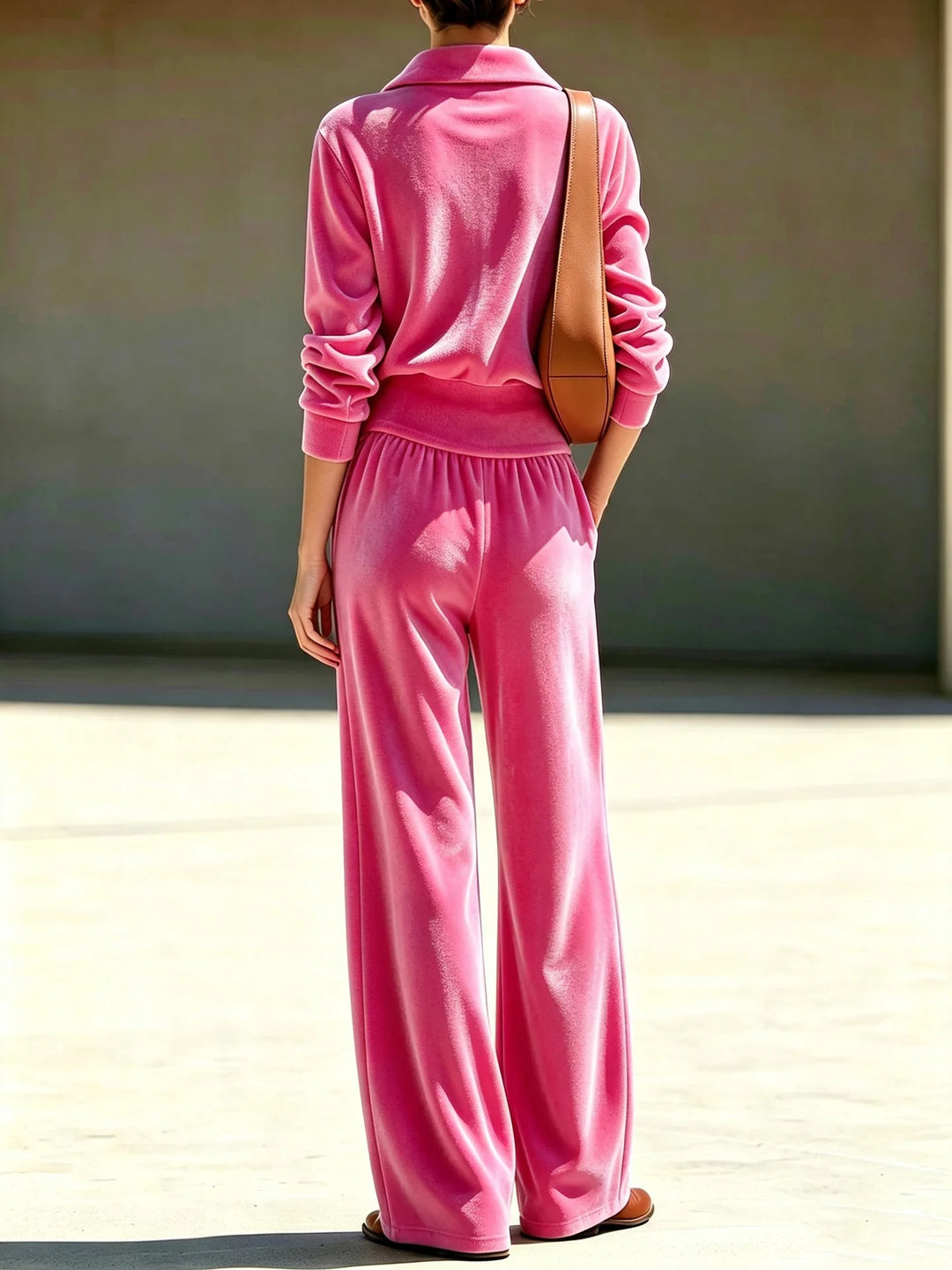 Back view of pink velour half-zip top and wide leg pants set