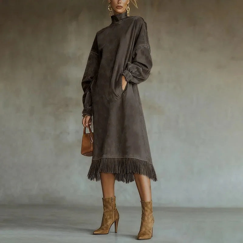 Woman wearing coffee brown mock neck sweatshirt dress with tassel fringe hem, front view