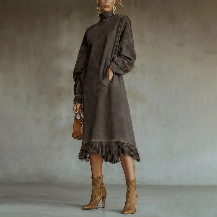 Woman wearing coffee brown mock neck sweatshirt dress with tassel fringe hem, front view