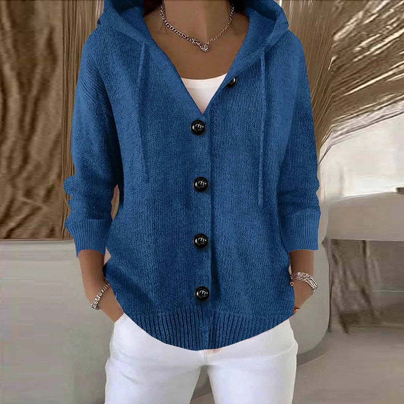 Woman wearing blue hooded button-front cardigan sweater