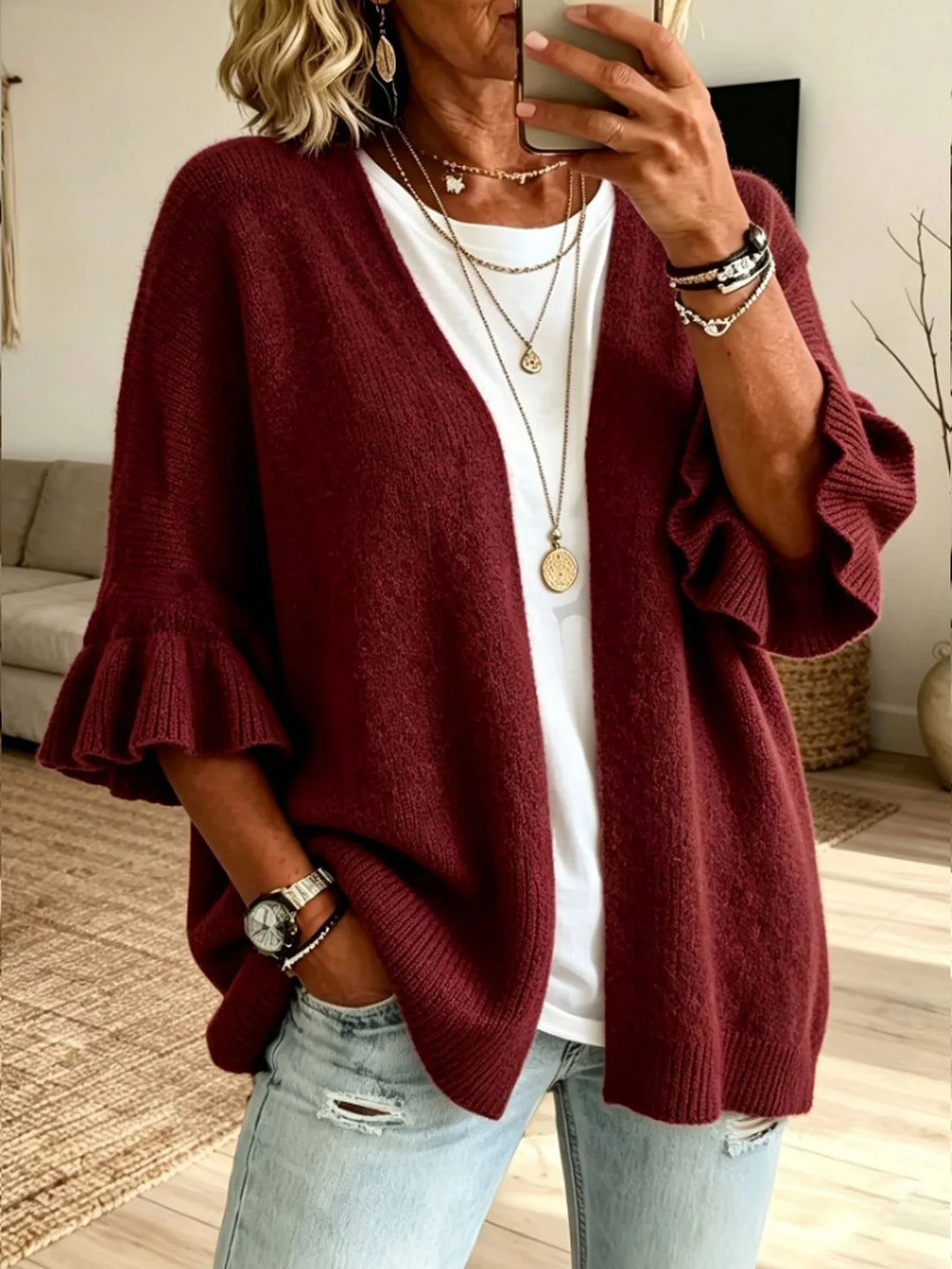 Burgundy red knit cardigan with ruffle sleeves, front view